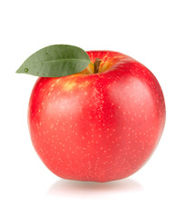 A ripe red apple with green leaf