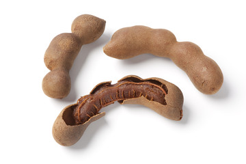 Whole and broken tamarind pods