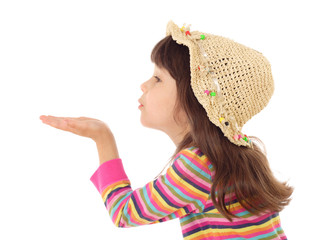 Little girl blows with an empty hand, isolated on white