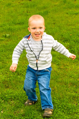 child walking across meadow