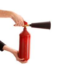 Naklejka premium fire extinguisher in the hands on white background