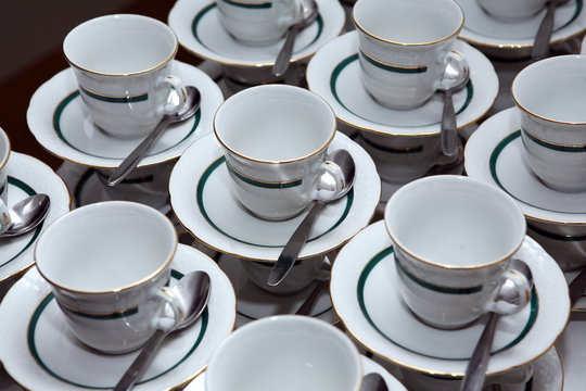 White porcelain tea cups with gold decoration