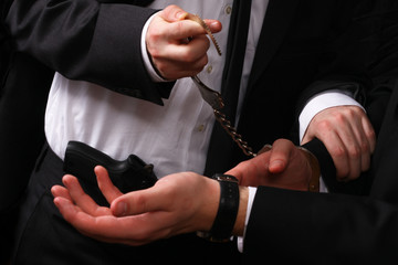 business man being handcuffed