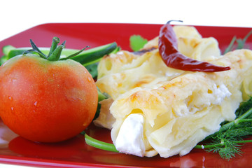 cannelloni served with pepper and tomato