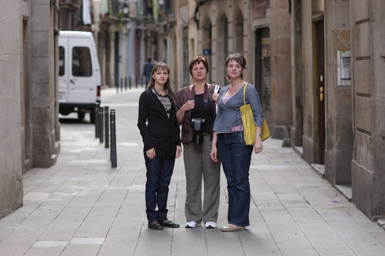 Women poses in gothic quarter of Barcelona