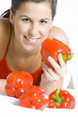 portrait of lying down woman with peppers