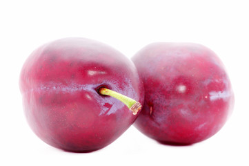 two plums isolated over white