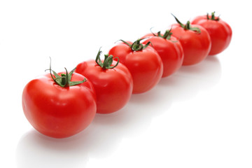 Red tomatoes, isolated.