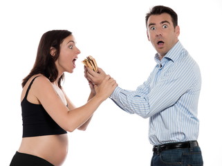 Couple expecting baby give hamburger