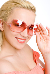 The woman in pink sun glasses