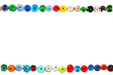unique glass beads forming a border, on white
