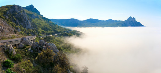 Morning view of coastline in mist and highway