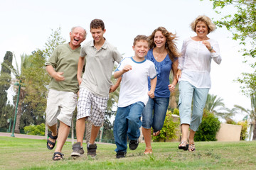 Happy family enjoying outdoors - Powered by Adobe