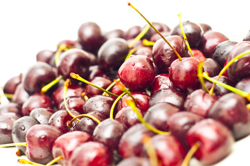 closeup of cherries with visible droplets isolated