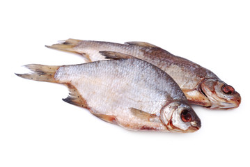 Two dried whole sea roach on white