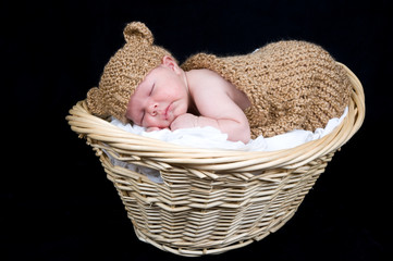 Beautiful baby boy in teddy bear hat