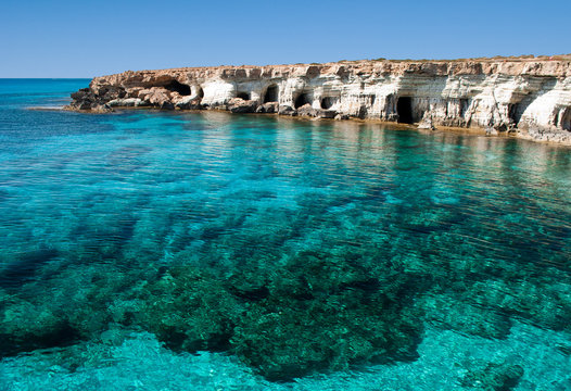 Sea caves near Cape Greko. Mediterranean Sea.