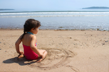 Little girl at the beach