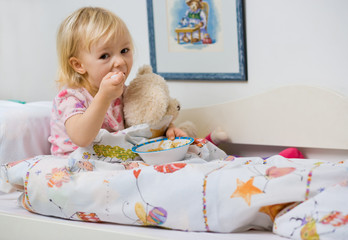 little girl eating in bed © mbt_studio