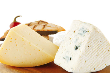 cheeses and salmon on wood