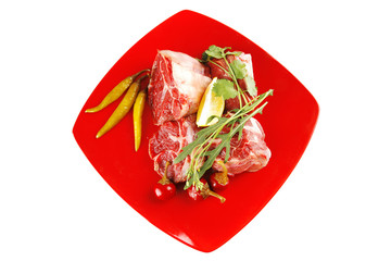 raw beef medallion on red