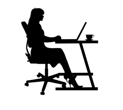 silhouette of a woman typing at a laptop