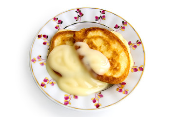Obraz na płótnie Canvas Two pancakes with condensed milk