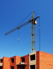 Building under construction with crane