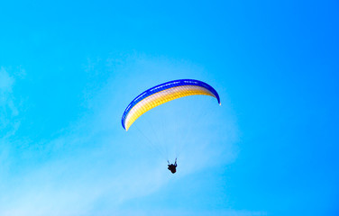 Parachute against the pure blue sky