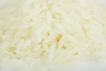 Pile of organic rice (on white)