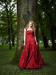 Fototapeta premium beautiful young girl in a red dress