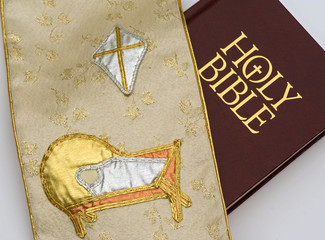 Holy bible and tapestry cloth with nativity baby Jesus & star