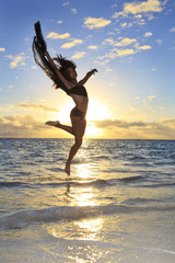beautiful black female dancer leaping in the air
