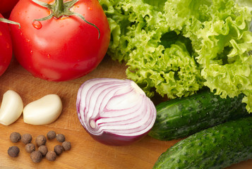 Fresh vegetables on wooden hardboard