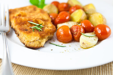 Schnitzel with roasted vegetables and herbs