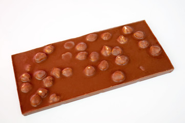 Bar of milk chocolate with whole hazelnuts