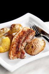 roasted pork meat with potatoes