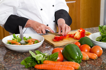 professional chef making salad