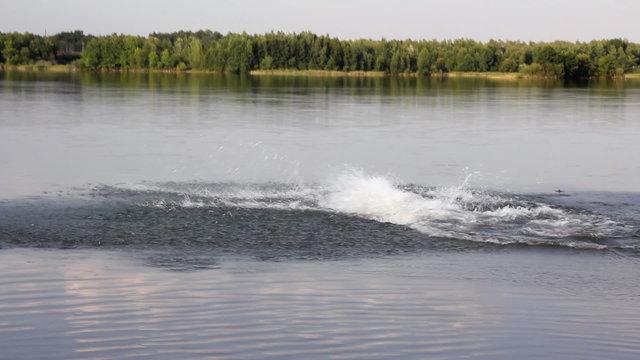 boy jumping in lake - summer vacations