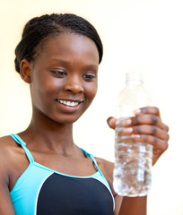 Fototapeta premium Young woman drinking water