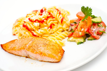 salmon served with pasta and salad