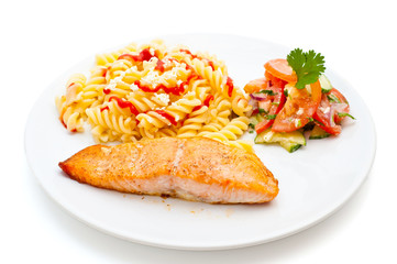 salmon served with pasta and salad