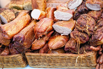 Assortment of Smoked Ham in wicker basket