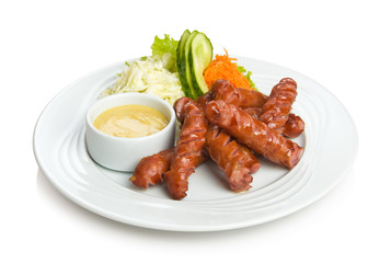 Fried sausages with a vegetable side dish