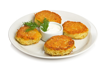 Four potato cakes on a white plate