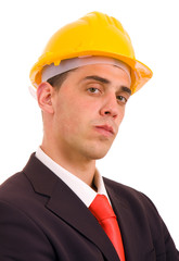 young engineer portrait with a yellow helmet, isolated on white