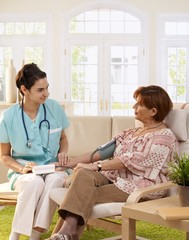 Obraz premium Nurse measuring blood pressure