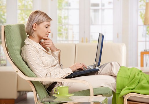Woman working with computer at home