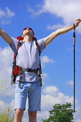 Hiker with raised arms