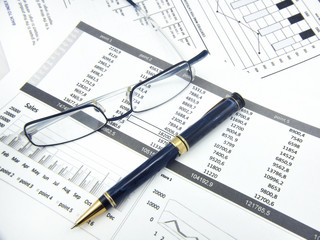 Stock statistic with pencil and glasses